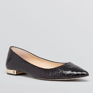 Tory Burch pointed toe black flats.
